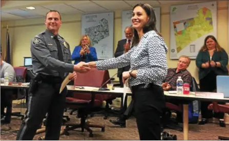  ?? MATT FREEMAN – FOR DIGITAL FIRST MEDIA ?? Kennett Township Police Chief Lydell Nolt gives Detective Amanda Wenrich a commendati­on for her work in linking a township burglary to a burglary ring operating throughout the Delaware Valley.