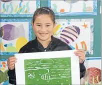  ??  ?? Special place: Cedella Pawa from Ngati Toa School with her artwork of Mana Island. She said the island was special because a taniwha landed on it and said the land and sea needed to be protected by everyone.