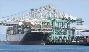  ??  ?? Shipping containers from China and other nations are unloaded at the Long Beach Port in Los Angeles, on February, 2019. Worsening ties could undo the trade deal signed in January.