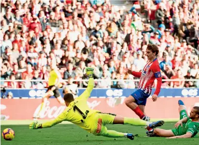  ?? AFP ?? antoine Griezmann scores a goal against deportivo alaves during the la liga match. —