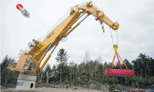  ?? RYAN TAPLIN • THE CHRONICLE HERALD ?? A crane operator demonstrat­es a new HAW66-300K marine crane at Hawboldt Industries in Chester on Wednesday. The crane will be used by the Canadian Coast Guard.