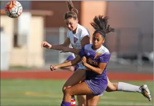  ?? Katherine Lotze /The Signal ?? Hart High’s Kassie Matthews, left, and Valencia’s Catelyn Edwards battle for a ball during a Foothill League game earlier this season.