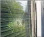  ?? DALLAS MORNING NEWS VIA THE ASSOCIATED PRESS] ?? A bullet hole from the police officer's shot is seen Tuesday in the rear window of Atatiana Jefferson's home in Fort Worth, Texas. [TOM FOX/ THE