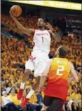  ?? RICK BOWMER — THE ASSOCIATED PRESS FILE ?? In this file photo, Houston Rockets forward Trevor Ariza (1) lays the ball up as Utah Jazz forward Joe Ingles (2) defends during the first half in Game 3 of an NBA basketball second-round playoff series, in Salt Lake City.