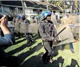  ??  ?? Riot police banged on their shields in a bid to end a Nelson Chamisa press conference