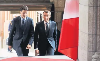  ?? LUDOVIC MARIN/AFP/GETTY IMAGES ?? Prime Minister Justin Trudeau welcomes French President Emmanuel Macron on Wednesday. The G7 is in Quebec this weekend.