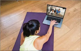  ?? DREAMSTIME/TNS ?? Pandemic-fueled online fitness classes have brought on a long-term change in the way — and the places — that people work out.