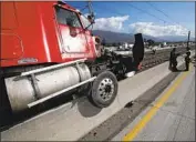  ?? Mark Boster Los Angeles Times ?? A BIG RIG sits wrecked on the Gold Line after a collision on the adjacent 210 Freeway in October 2010.