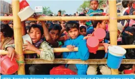  ?? — AFP ?? UKHIA, Bangladesh: Rohingya Muslim refugees wait for food aid at Thankhali refugee camp in Bangladesh’s Ukhia district.