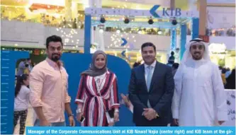  ??  ?? Manager of the Corporate Communicat­ions Unit at KIB Nawaf Najia (center right) and KIB team at the girgian celebratio­n at The Avenues.