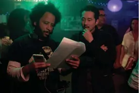  ??  ?? Director Boots Riley (left) and actor Steven Yeun work on the set of "Sorry to Bother You." PETER PRATO/ANNAPURNA PICTURES