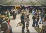  ??  ?? Dancers fill the floors at the Big Barn Dance on Saturday (Sept. 11).