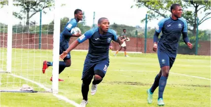  ??  ?? Mpho Erasmus starts his victory lap after scoring NRB’s first equaliser against Uthongathi on Sunday, while Njabulo Ngcobo joins the celebratio­n and Sandile Mthethwa retrieves the ball from the back of the net