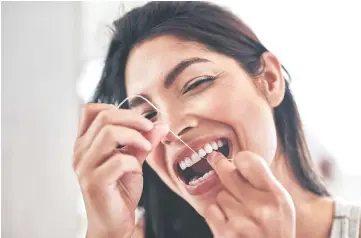  ??  ?? Flossing your teeth with certain types of floss could expose you to higher levels of toxic chemicals according to new research.