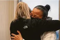  ??  ?? Shooting victim Delmar Rene Nolasco’s half-sister, Alexis Rogers, hugs mom Leticia DelBosque at court Friday. Nolasco is one of 275 slaying victims of 2019 in Houston.