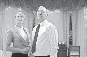  ?? DAVID GIESBRECHT ?? Super-scheming couple Claire and Frank Underwood (Robin Wright and Kevin Spacey) send the political intrigue in the White House way, way over the top on House of Cards.