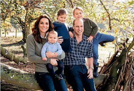  ??  ?? This photo released by Kensington Palace shows the photo taken by Matt Porteous of Britain’s Prince William and Kate, Duchess of Cambridge with their children Prince George, right, Princess Charlotte, centre, and Prince Louis at Anmer Hall in Norfolk, east England, which is to be used as their 2018 Christmas card.