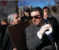  ?? AP/The Daily Progress/ZACH WAJSGRAS ?? Jason Kessler pushes through a crowd of protesters at the Charlottes­ville, Va., courthouse for a hearing in February. Kessler’s applicatio­n for a permit to hold a “white civil rights” rally near the White House has been preliminar­ily approved by the...