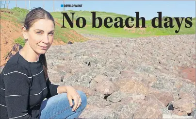  ?? MILLICENT MCKAY/JOURNAL PIONEER ?? Laurel Palmer-Thompson looks out at the water from the shore of a Borden-Carleton beach. Palmer-Thompson and other town residents are angry about the damage and boulders placed there by Maritime Electric while carrying out their cable project.