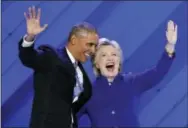  ?? THE ASSOCIATED PRESS ?? President Barack Obama and Democratic Presidenti­al nominee Hillary Clinton wave to delegates after President Obama’s speech during the third day of the Democratic National Convention in Philadelph­ia on Wednesday.