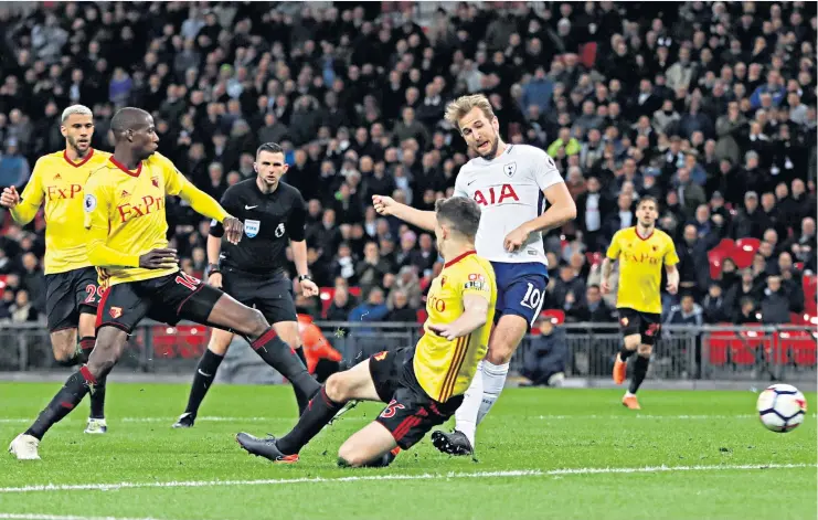  ??  ?? Foot perfect: Harry Kane slides in Tottenham’s second goal at Wembley