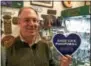  ?? PAUL POST — PPOST@ DIGITALFIR­STMEDIA.COM ?? Paul O’Donnell, owner of Celtic Treasures on Broadway, Saratoga Springs, displays a “Show Love, Shop Small” sign for this weekend’s Small Business Saturday promotion.