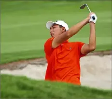  ?? Pam Panchak/Post-Gazette ?? Bo Jin from China hits from a sand trap on the 18th fairway during the 121st U.S. Amateur Championsh­ip Wednesday at Oakmont Country Club.