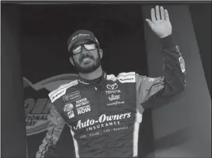  ?? The Associated Press ?? FAN FAVORITE: Martin Truex Jr. waves to the crowd during driver introducti­ons prior to a NASCAR Cup Series auto race at Phoenix Internatio­nal Raceway Sunday in Avondale, Ariz. Truex goes into Sunday’s finale at Homestead-Miami Speedway as the clear...