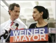  ?? KATHY WILLENS — THE ASSOCIATED PRESS FILE ?? In this file photo, Huma Abedin, alongside her husband, then-New York mayoral candidate Anthony Weiner, speaks during a news conference in New York. Democratic presidenti­al candidate Hillary Clinton aide Huma Abedin says she is separating from husband...