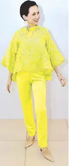  ??  ?? Bettina Osmeña and Dina Tantoco in lime and lemon ruffled pantsuits