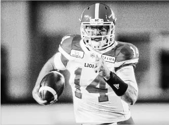  ?? JEFF MCINTOSH THE CANADIAN PRESS ?? B.C. Lions quarterbac­k Travis Lulay completed 14-of-26 passes for 193 yards against the Stampeders in Calgary on Saturday. Lulay made his first start since Sept. 14 because of a shoulder injury.