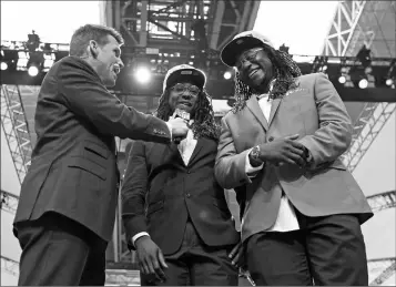 ?? ASSOCIATED PRESS ?? NFL NETWORK’S SCOTT HANSON (LEFT) talks with Seattle Seahawks cornerback Shaquill Griffin (center) and Shaquem Griffin on stage during the NFL draft in Arlington, Texas, Saturday.