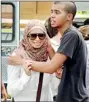  ??  ?? Family members of victims console each other following the fire in the Villagio shopping mall in the Qatari capital Doha