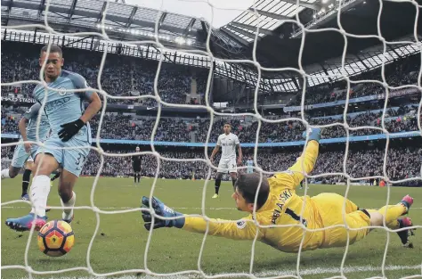  ??  ?? Gabriel Jesus breaks Swansea’s hearts with yesterday’s late winner for Manchester City, beating the despairing dive of keeper Lukasz Fabianski