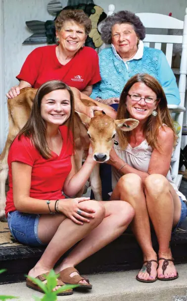  ??  ?? Guests at Hedgebrook can stay at the Herds
Inn and take tours of the farm (left). Above, Miss Kitty; her mother, Kitty; Shannon and Meghan represent four generation­s of this farm family.