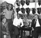  ??  ?? Tom Saunders (left), Ronnie Moran (second left), Joe Fagan and Bob Paisley (right) in the Anfield boot room before Steve Heighway’s testimonia­l in 1981. Photograph: Bob Thomas Sports Photograph­y/ Getty Images