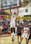  ?? DENNIS KRUMANOCKE­R - FOR DIGITAL FIRST MEDIA ?? Kutztown senior Josh Johnson throws down a dunk against East Stroudsbur­g on Feb. 15.