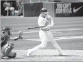  ?? DOUG DURAN — BAY AREA NEWS GROUP ?? The Oakland Athletics’ Matt Chapman hits a solo home run in the seventh inning Wednesday against the Los Angeles Dodgers in Oakland.