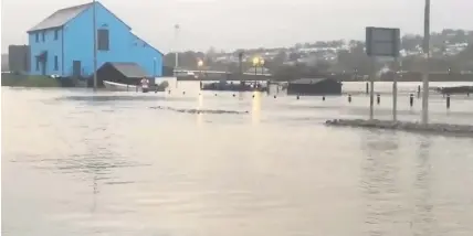  ??  ?? Rising water levels made for hazardous conditions in Carmarthen