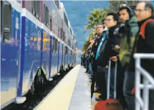  ?? Paul Chinn / The Chronicle ?? Commuters wait for an Altamont Corridor Express train in Pleasanton. ACE says it will be able to make the deadline.