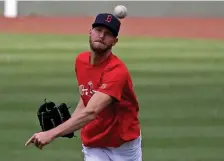  ?? STuArT CAhill / hErAld sTAff filE ?? GETTING CLOSER: Sox ace Chris Sale throws at Fenway Park on Saturday. Sale threw a bullpen session at Polar Park in Worcester on Tuesday.