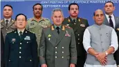  ?? — PTI ?? ( From left) China’s defence minister Wei Fenghe, Russian defence minister Sergei Shoigu and defence minister Rajnath Singh pose for a photo with their colleagues at a joint meeting of defence ministers of Shanghai Cooperatio­n Organisati­on in Moscow on Friday.