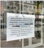  ?? (Arkansas Democrat-Gazette/Eric E. Harrison) ?? Closure signs have appeared in the window of A.W. Lin’s (above) and on the doors of Soul Fish and Brewski’s Pub & Grub in the 300 block of Little Rock’s Main Street.