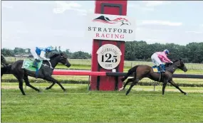  ??  ?? Guillada ridden by Rosie Myers crosses the finish line in first place, ahead of Reflection with jockey Lisa Allpress.