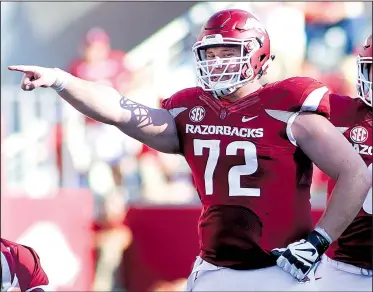  ?? Democrat-Gazette file photo ?? Arkansas center Frank Ragnow, who started 33 games with the Razorbacks before suffering an ankle injury last season, is expected to be one of the first offensive linemen chosen when the NFL Draft begins today at AT&T Stadium in Arlington, Texas.