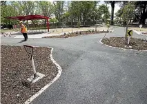  ?? PHOTO: MURRAY WILSON/STUFF ?? An off-road roundabout takes shape at Palmerston North’s junior road safety park.