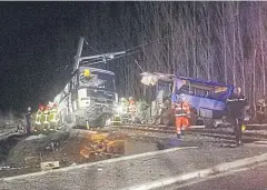  ?? EPA-EFE ?? Emergency personnel at the crash site of a school bus with a train near Millas and St-Feliu-d’Amont, France, on Thursday.