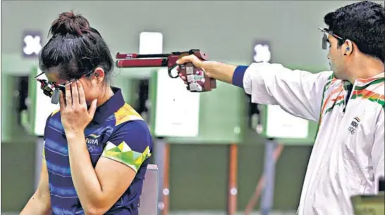  ?? PTI ?? Manu Bhaker and Saurabh Chaudhary during the 10m air pistol mixed team shooting qualificat­ion at the Asaka shooting range in Tokyo on Tuesday.