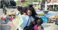  ?? CARLOS OSORIO/TORONTO STAR ?? Stephanie Gomes walked around the growing memorial at Alexander the Great Parkette and gave out hugs.