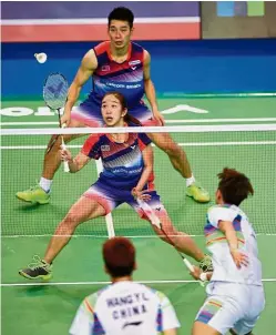  ?? — AFP ?? Focused: Cheah Yee See (centre) returns a shot as compatriot Chan Peng Soon looks on during the Korean Open mixed doubles semi-finals against China’s Wang Yilyu (bottom) and Huang Dongping in Seoul yesterday.